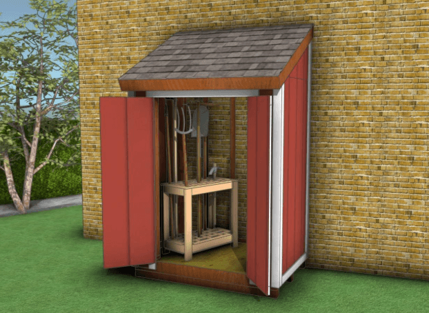 A small red lean-to shed with open double doors