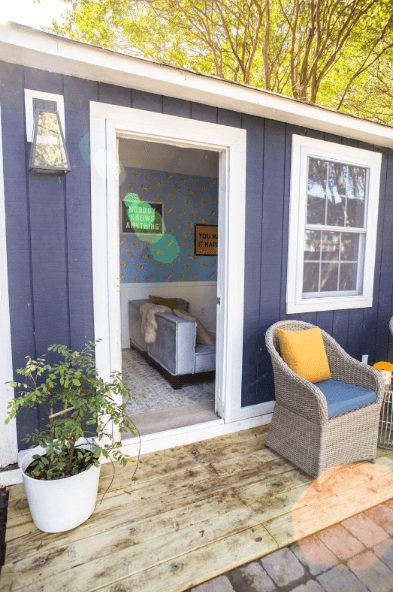 A dark blue shed designed for kids 